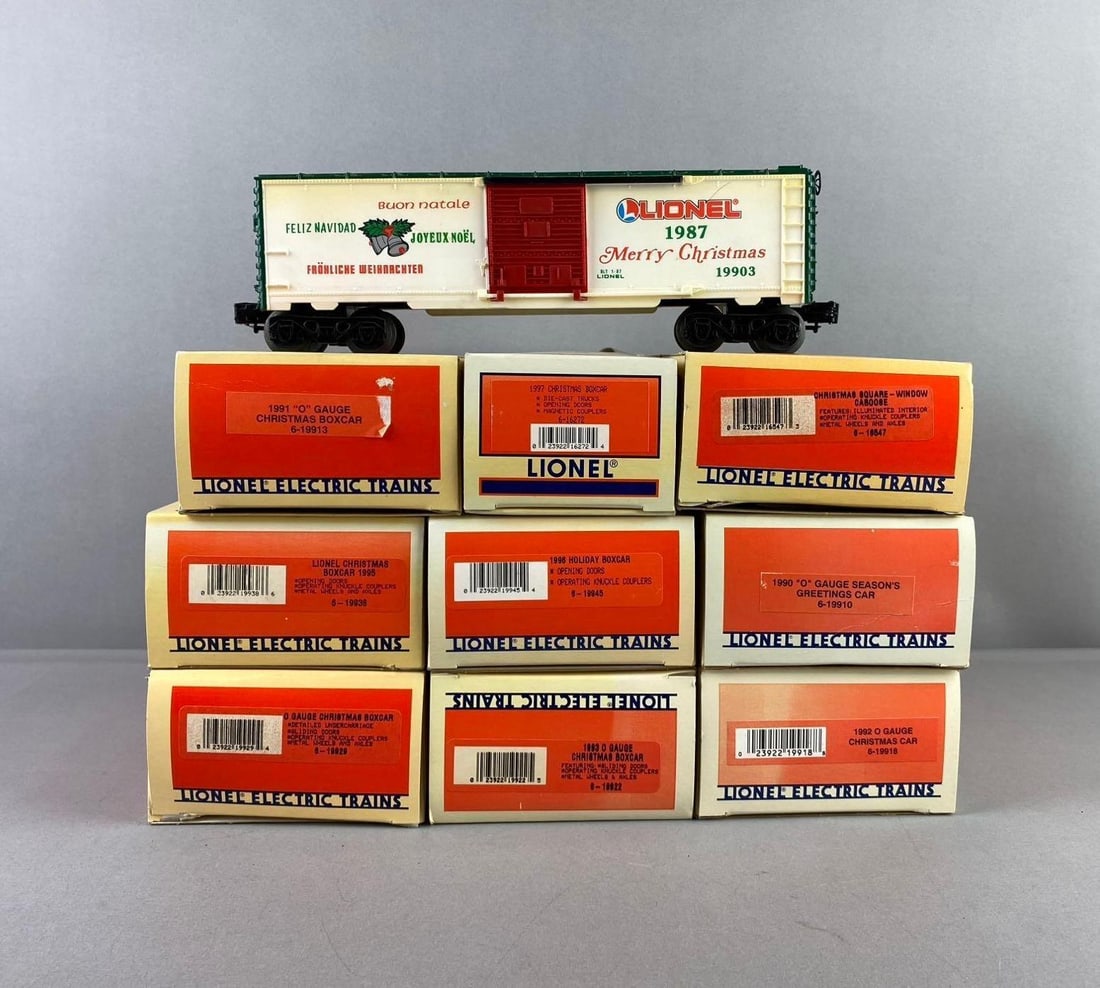Group of 10 Lionel Trains O Gauge Christmas Themed Boxcars and More: Include 1996 holiday car, 1992 holiday car, and more. Most like new in original packaging. Packaging measures H 2 1/2 x W 4 1/2 x L 11 1/2 inches.