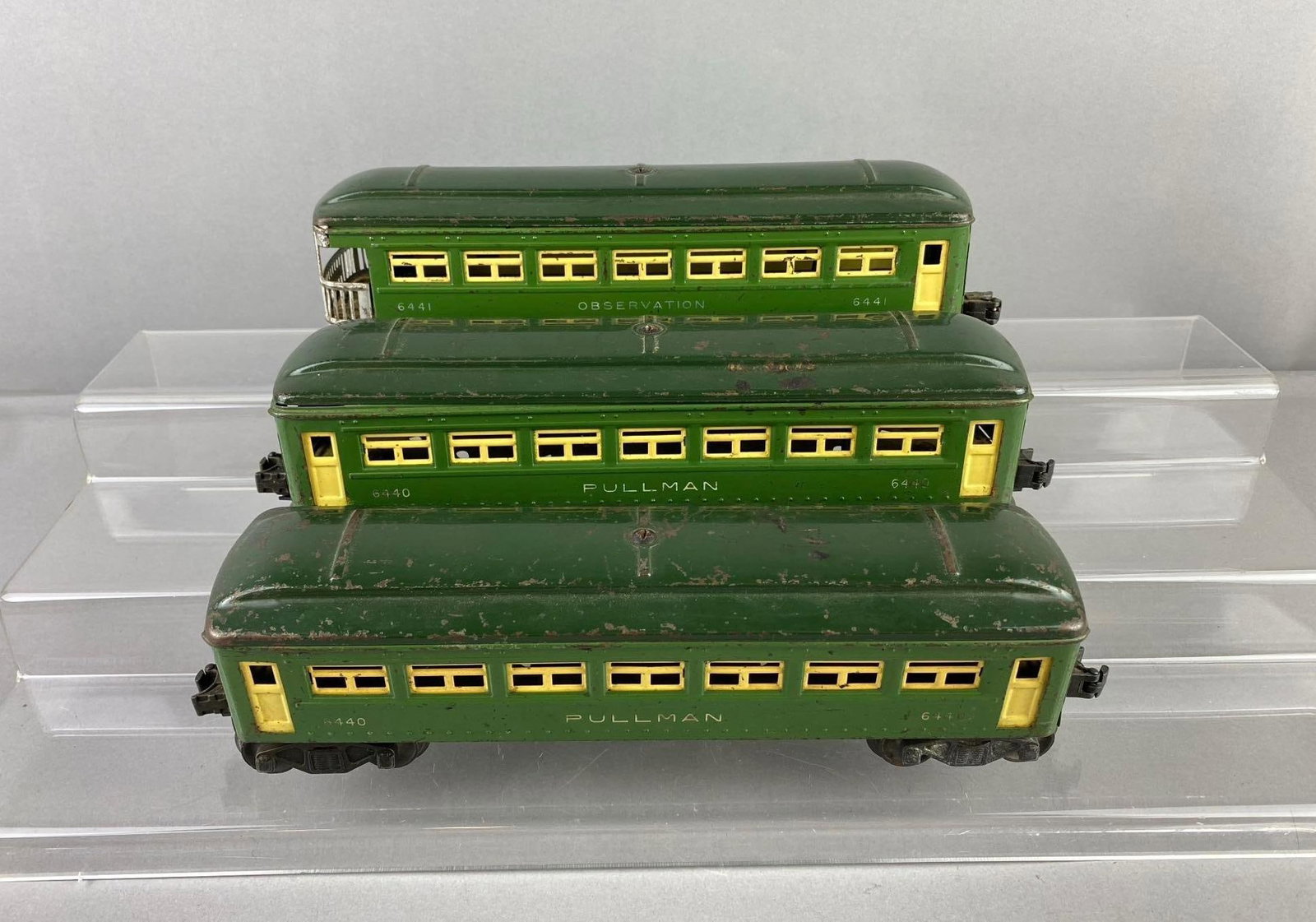 Group of 3 Lionel Trains O Gauge Pullman passenger Cars and More: Includes observation car. One measures H 3 x W 2 1/2 x L 10 inches. Stand not included.