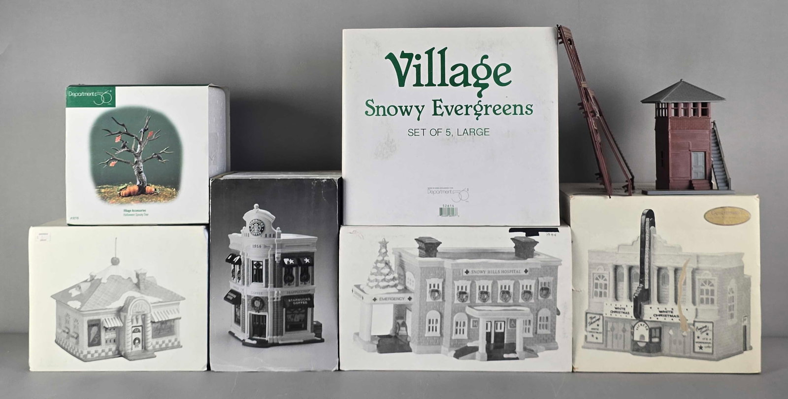 Group of Department 56 Village Buildings and Accessories: Includes Halloween spooky tree, snowy hills hospital, coffee shop and more, largest measures 11" H x 12" W x 4" D