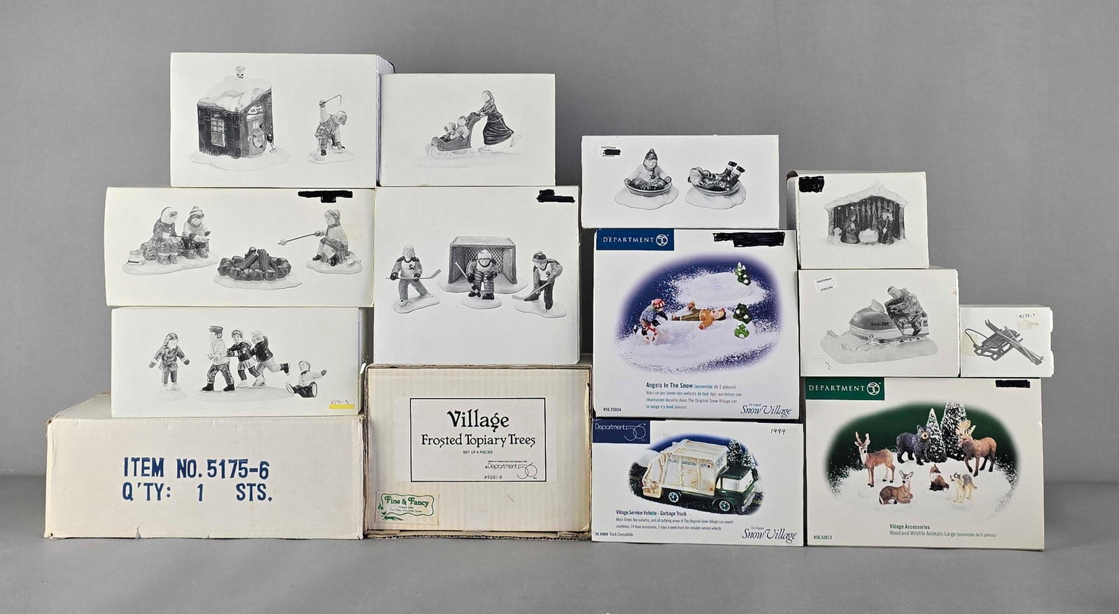 Group of Department 56 Village Accessories: In original boxes. Includes garbage truck, frosted topiary trees, angels in the snow and more, largest measures 6" H x 8" W x 4" D