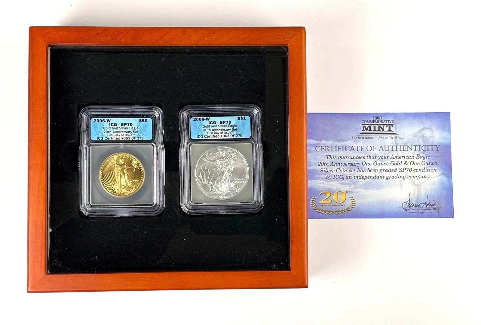 US Mint American Eagle 20th Anniversary Gold and Silver Graded Two Coin Set: Features 2006W uS American Silver Eagle 1 oz Fine Silver ICG SP70 and 2006W US $50 1 oz American Gold Eagle ICG SP70. Both are First day Issue. 63/279. Includes display case and COA