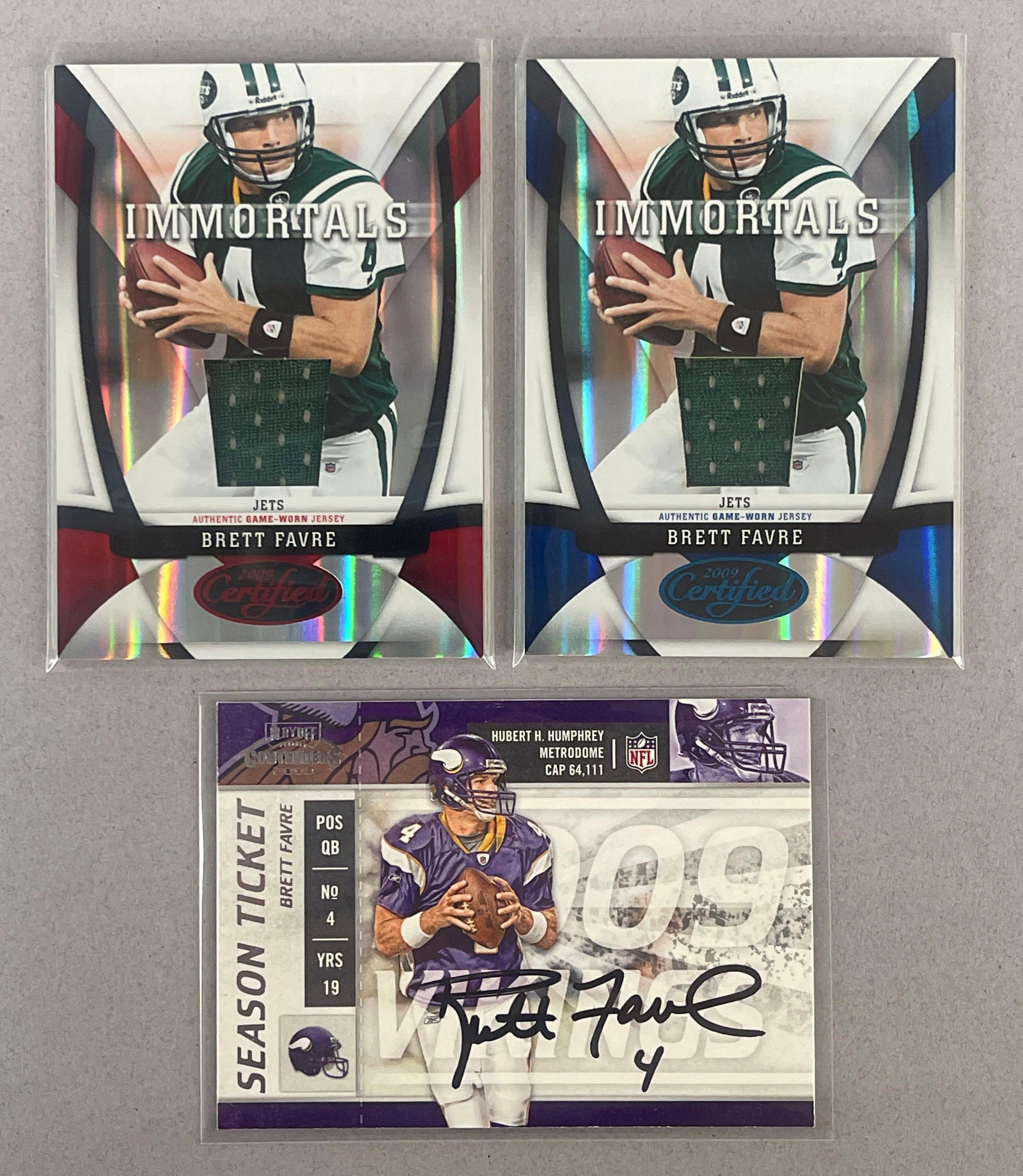 2009 Donruss Certified Immortals Mirror Blue 27/50, Mirror Red 60/100, and Contenders Auto Brett: 2 - Donruss Brett Favre Jersey #202, and 2009 Playoff Contenders Signed #57