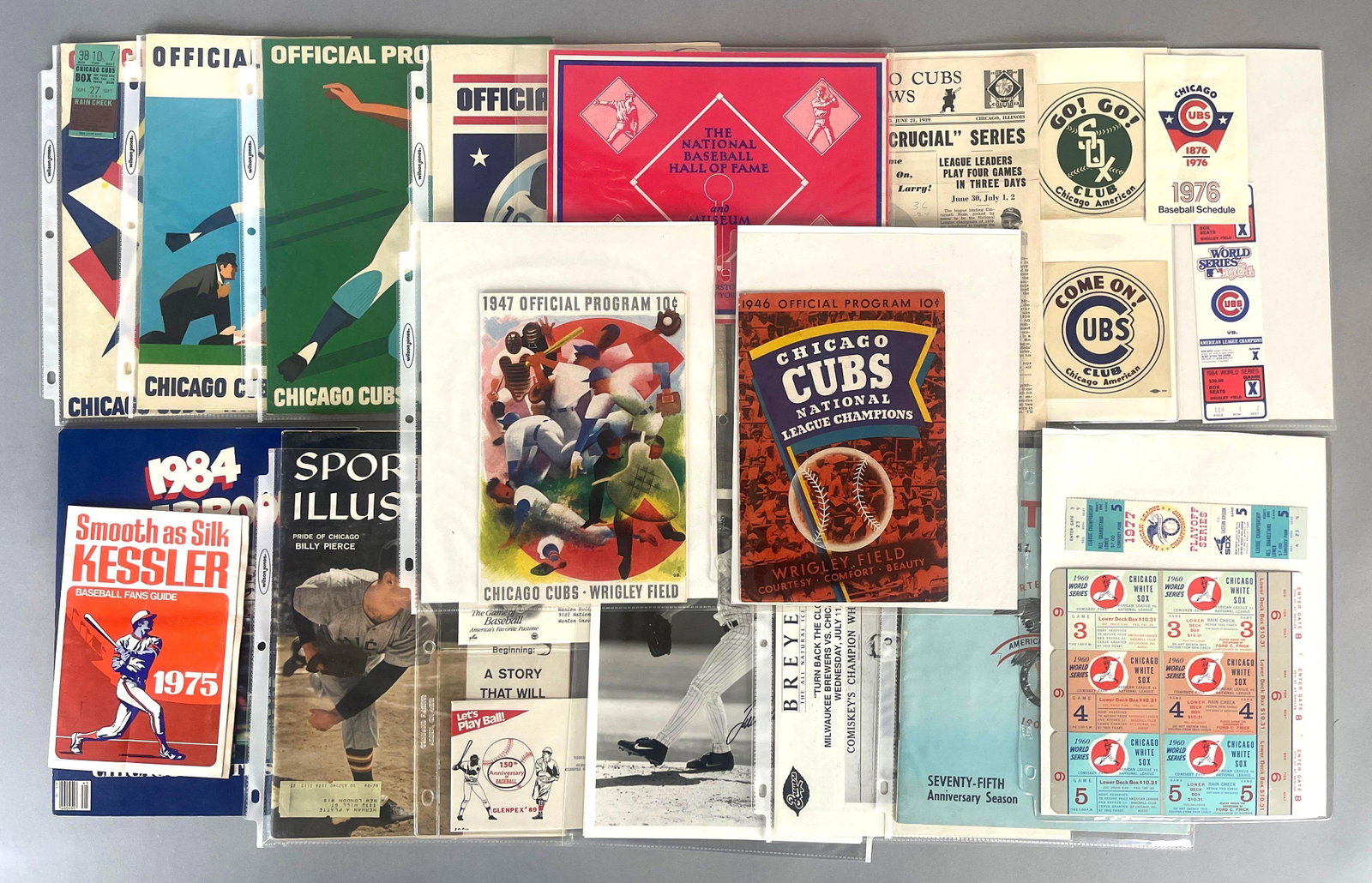 Group of Chicago Cubs and White Sox Programs, Tickets, and Decals: 1947 Chicago Cubs vs Brooklyn Dodgers Program with Jackie Robinson - Rookie, back cover missing, 1964 Tickets, 1970 Lou Boudreau signed program, Various phantom World Series tickets, 1950s decals,