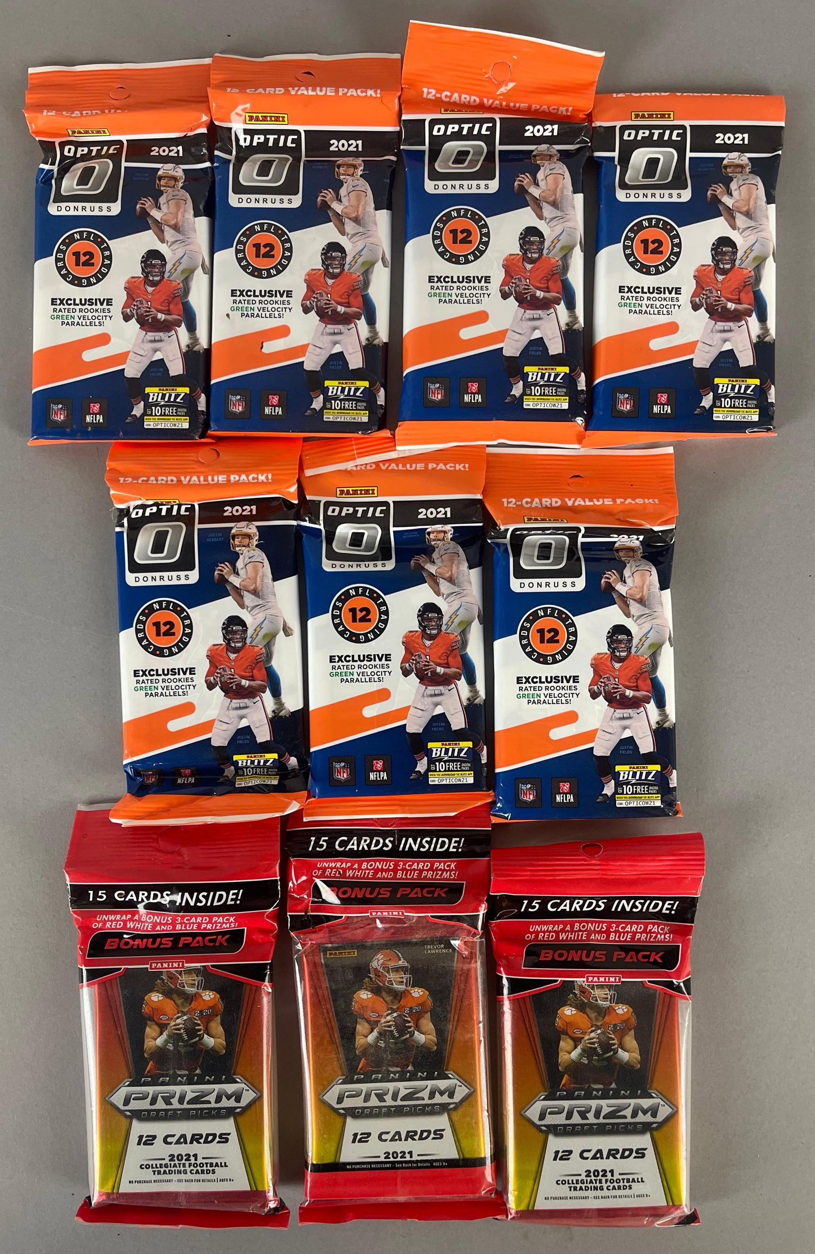 7 - 2021 Donruss Optic and 3 - 2021 Panini Prizm Football Value and Fat Packs: Optic 12 - Cards per pack, Prizm 15 - Cards per pack