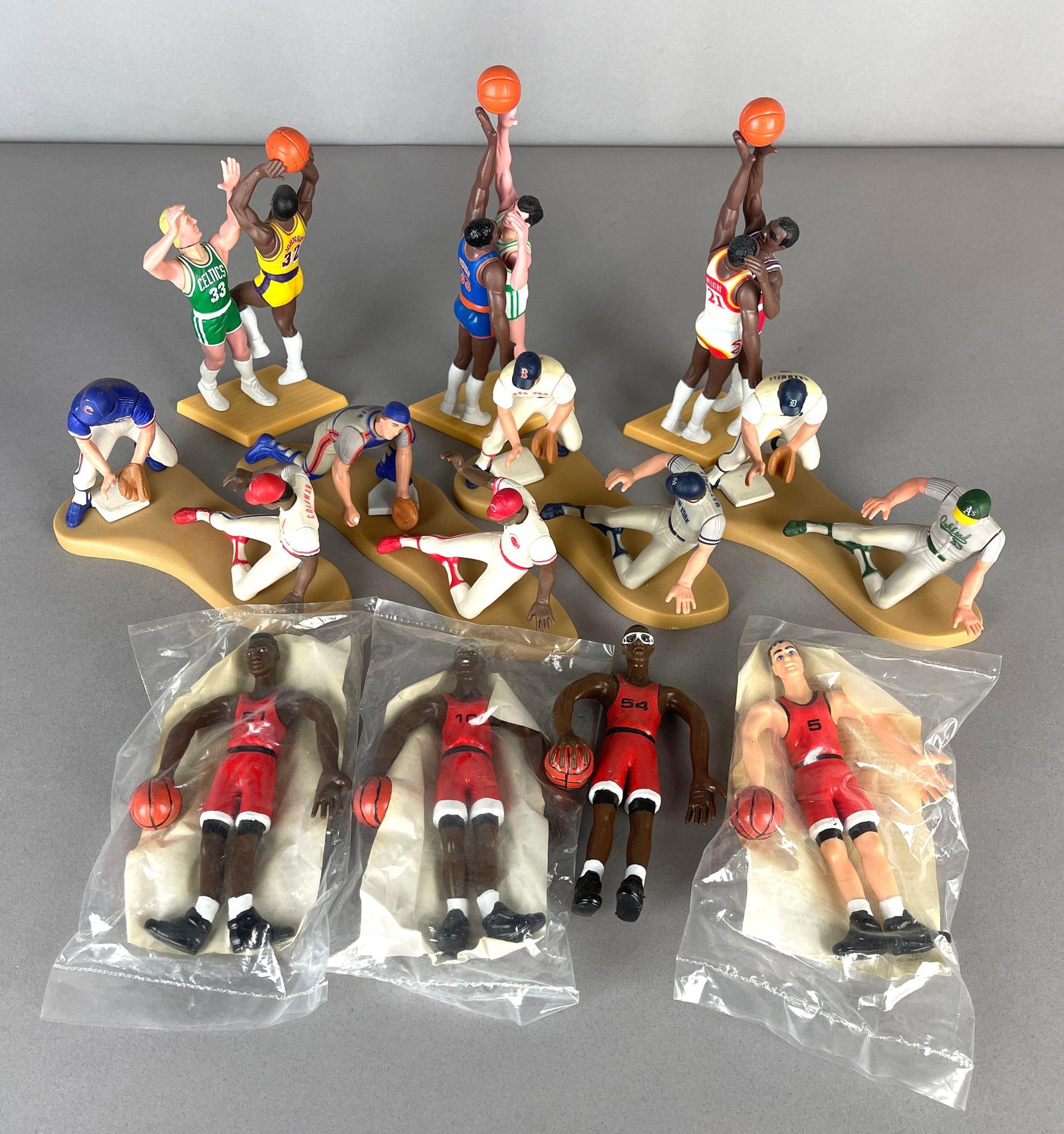 7 - 1989 Starting Lineup One on One Basketball and Baseball Figures + 4 Bendables: 4 - 1991 Chicago Bulls Bendables, 1989 One on One Johnson vs Bird, Wilkins vs Barkley, and Ewing vs McHale, 4 - 1989 Baseball One on One figures