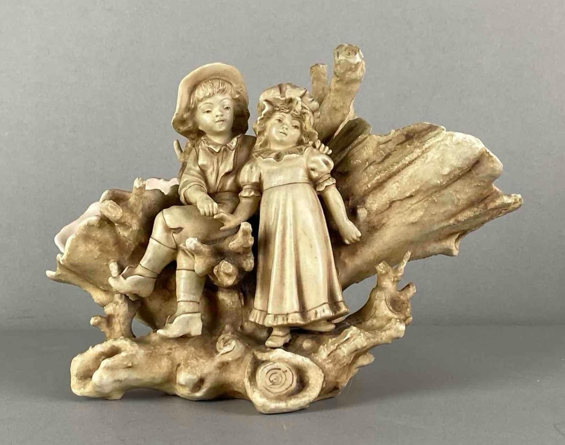 Boy and Girl Figural Porcelain Dual Vase: marked on base, measures 6 1/2 inches H x 9 1/2 inches W x 6 inches D