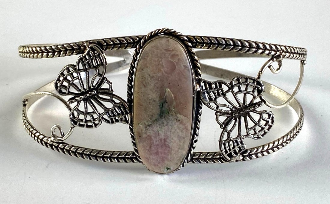 Silver Plated Costume Jewelry Butterfly Rhodochrosite Cuff Bracelet: Inner circumference Measures 8 1/2 inches with a 1 inches opening