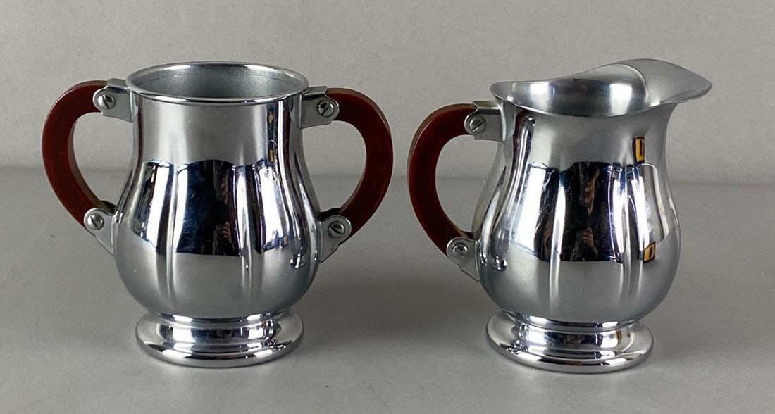 Vintage Farber Bros Krome-Kraft Creamer and Sugar: Bakelite handles, marked in base, creamer measures 4 inches H x 4 1/2 inches W x 3 inches D