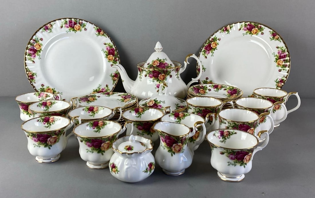 Group of 1962 Royal Albert Old Country Roses Porcelain Tea Set: All marked on base, includes teacups, saucers, teapot and more, plates each measures 10 1/2 inches in diameter