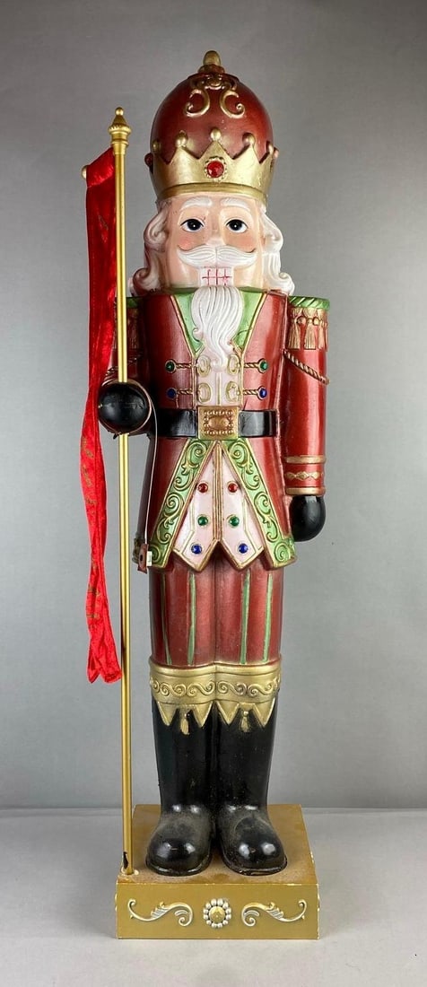 Holiday Light Up Blow Mold Nutcracker Statue: Light up Gemstones. Measure 39 inches in length.