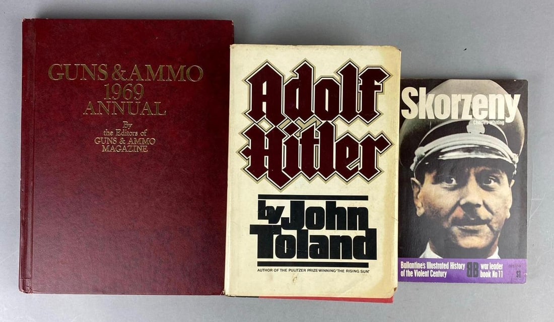 Group of 3 WW2 German Themed Books and More: Includes 1969 Guns and Ammo album, Adolf Hitler, and Skorzeny. Largest measures L 11 x W 8 1/2 inches.