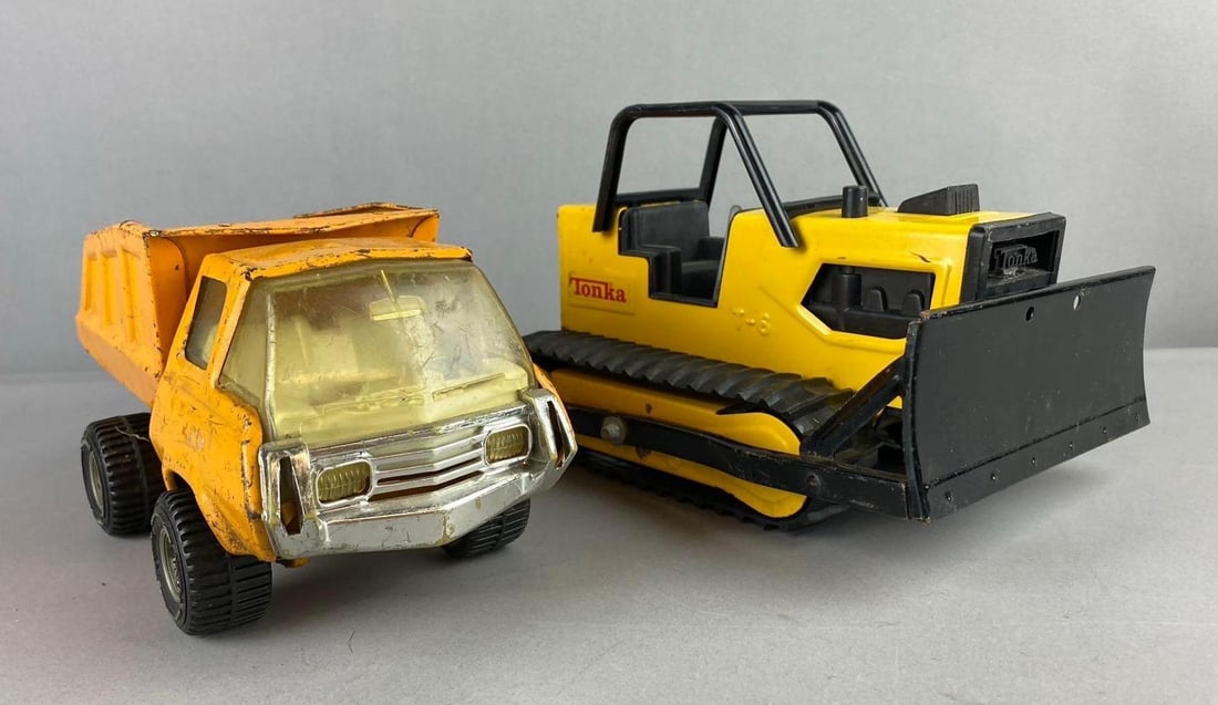 Group of 2 Tonka Construction Press Steel Vehicles: Largest measures H 5 x W 5 x L 9 inches.