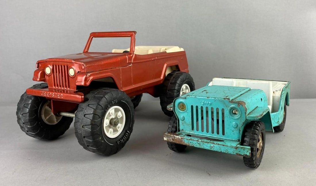 Group of 2 Tonka Jeep Press Steel Vehicles: Paint flakes and Rust throughout. Largest measures