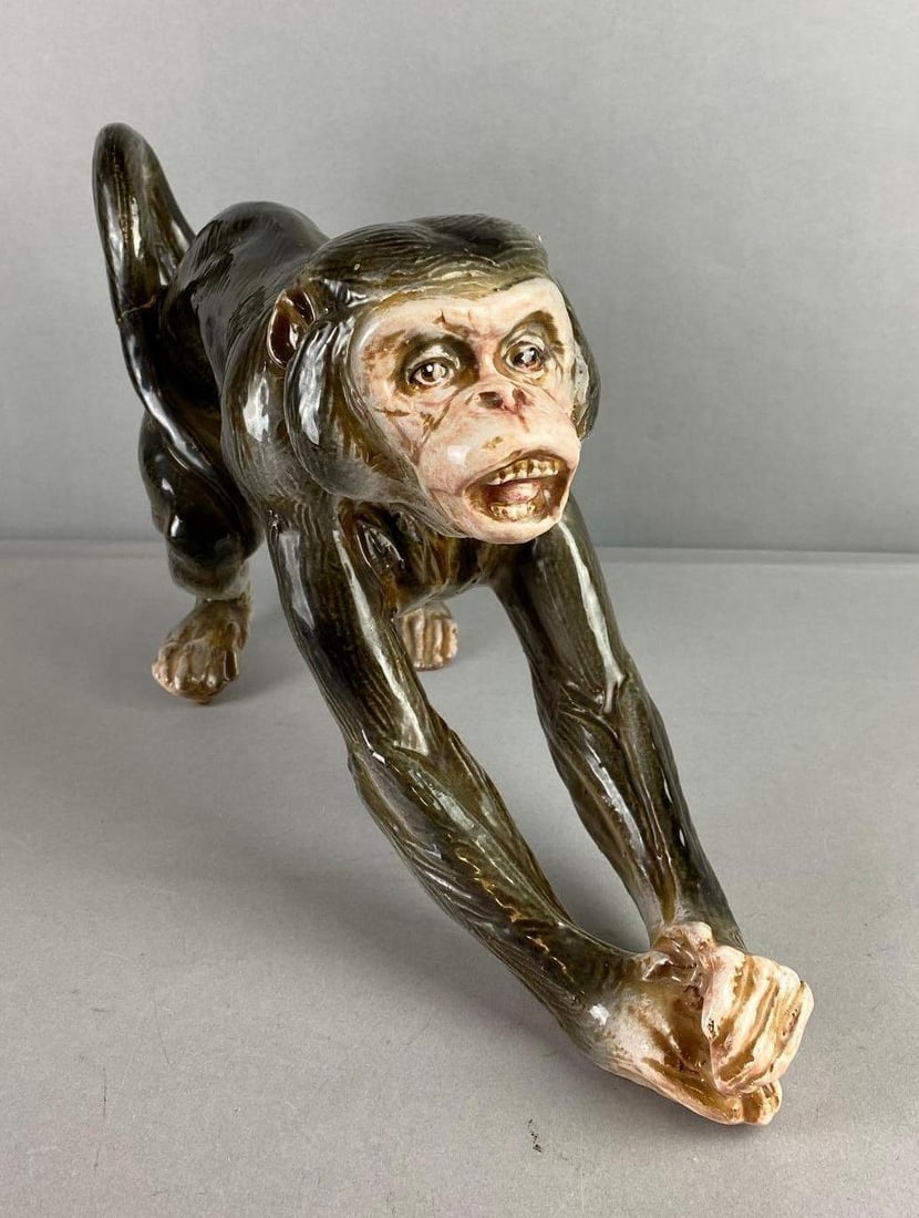 Italian Marwal Chimpanzee Glazed Clay Figure: has crack in tail. Measures H 9 x W 4 x L 14 inches.