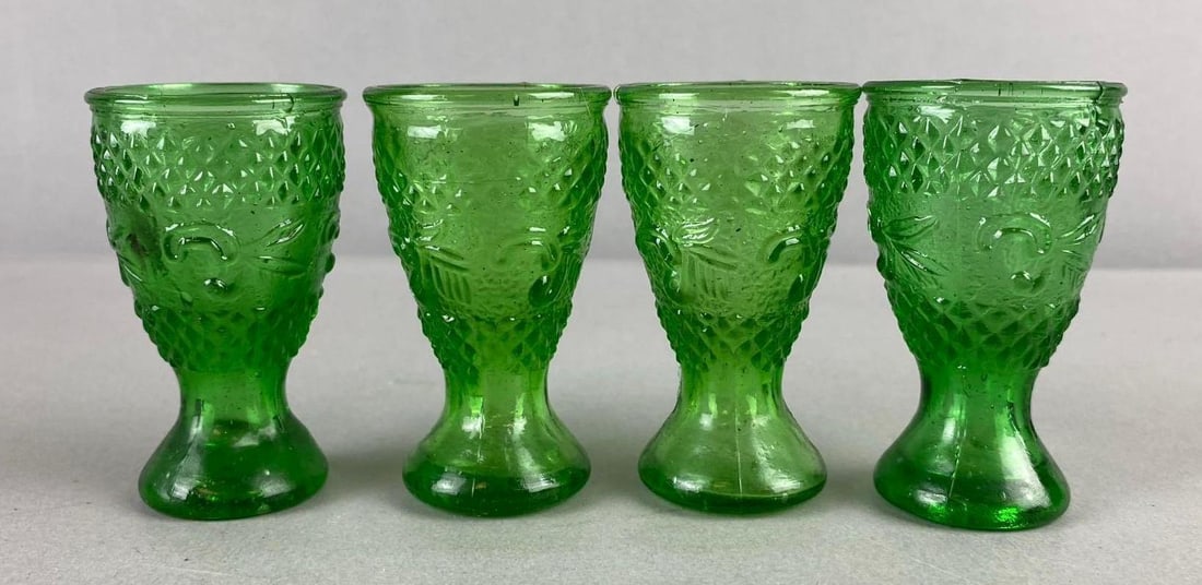 Group of 4 Green Pressed Glass Liqueur Goblets: One measure 3 inches in length.