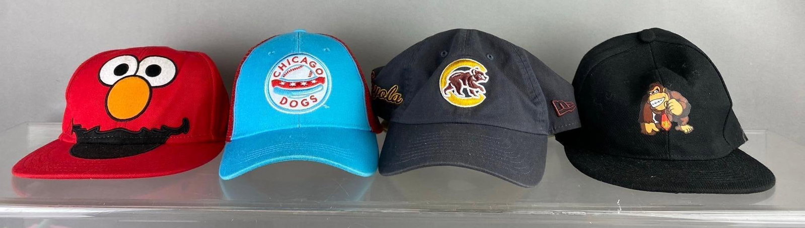 Group of Assorted Baseball Caps: Includes Elmo, Chicago Dogs, and more. adjustable sizes.