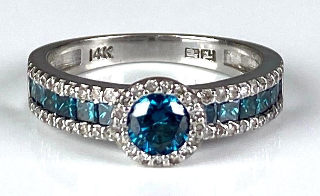Signed 14K White Gold Blue/Clear Diamond Ring: Total weight of 3.9 grams, size 7