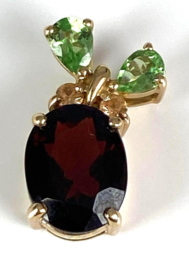 THL Signed 10K Yellow Gold Multi-Gem Pendant: Total weight of 1.5 grams, size 3/4 inches H x 1/4 inches W, features garnet, peridot and Citrine