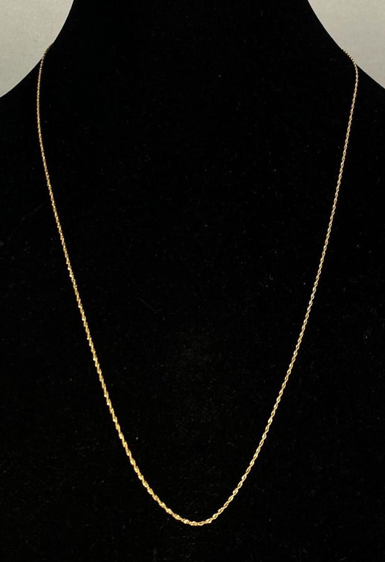 Italian 14K Yellow Gold Twisted Chain Necklace: Total weight of 1.5 grams, measures 24 inches In length