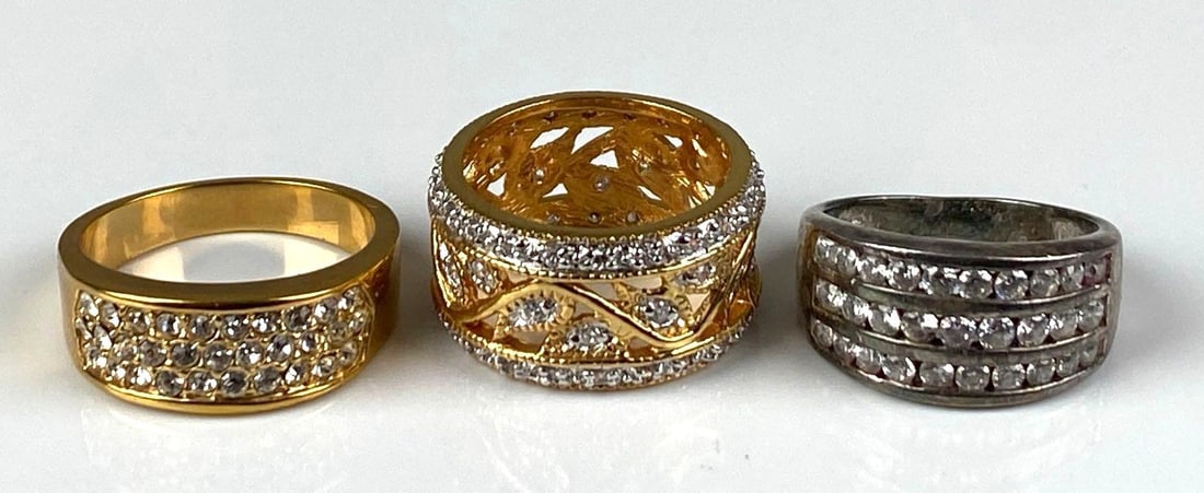 Group of 3 Rings: Includes 2 sterling silver CZ Rings and 1 costume jewelry ring, sizes range from 9-11