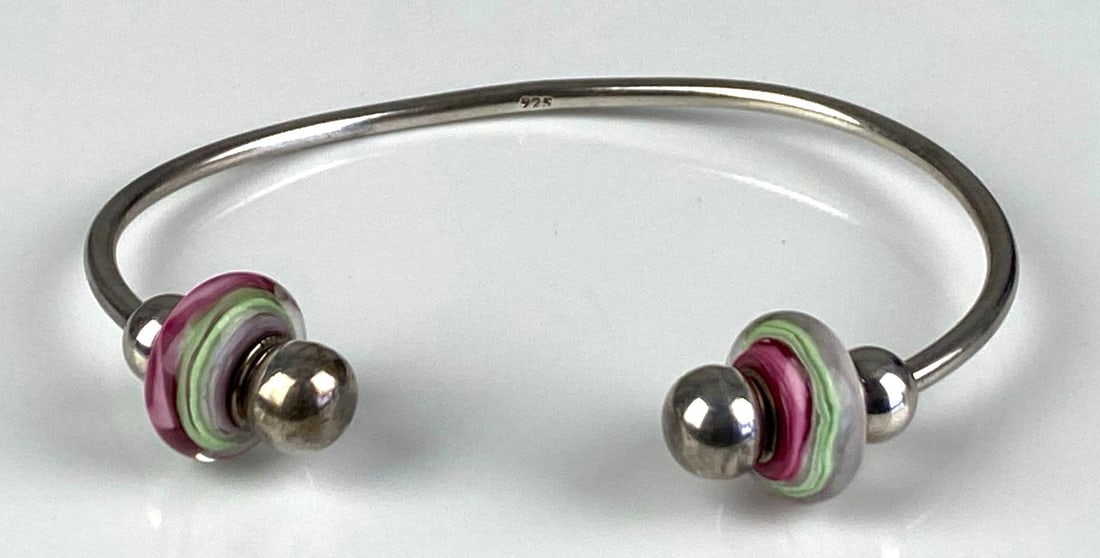 Sterling Silver Cuff Bracelet: Inner circumference measures 7 1/2 inches with a 1 inches opening