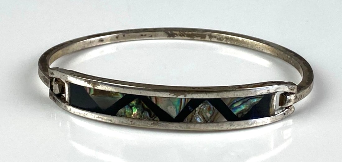 Silver Mother of Pearl Cuff Bracelet: Inner circumference measures 6 1/2 inches