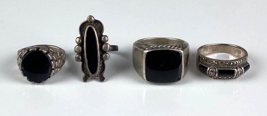 Group of 4 Sterling Silver Onyx Rings: Sizes range from 7-10