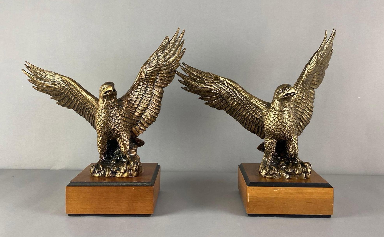 Group of 2 1990s Arlington Heights Ford Cast Iron Awards: top New Volume Dealer awards, 1993 and 1999, one eagle has chipped feather, each measures 14 1/2 inches H x 14 inches W x 6 1/2 inches D