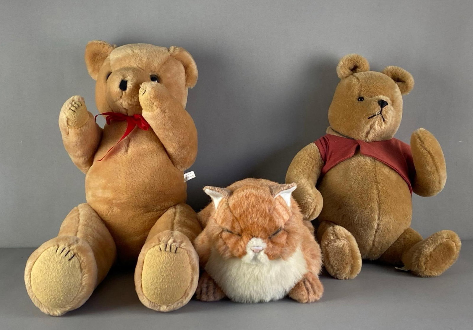 Group of 3 Plush Toys: Includes teddy bear, cat and Winnie the pooh bear, largest measures 30 inches H