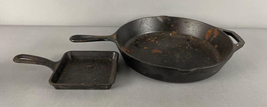 Group of 2 Lodge Cast Iron Pans: Largest measures 12 1/2" x 18" x 2 1/4"