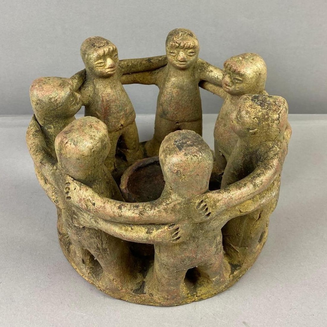 Vintage Mexican Handmade Circle of Friends Candle Holder: Measure 10 inches in diameter.