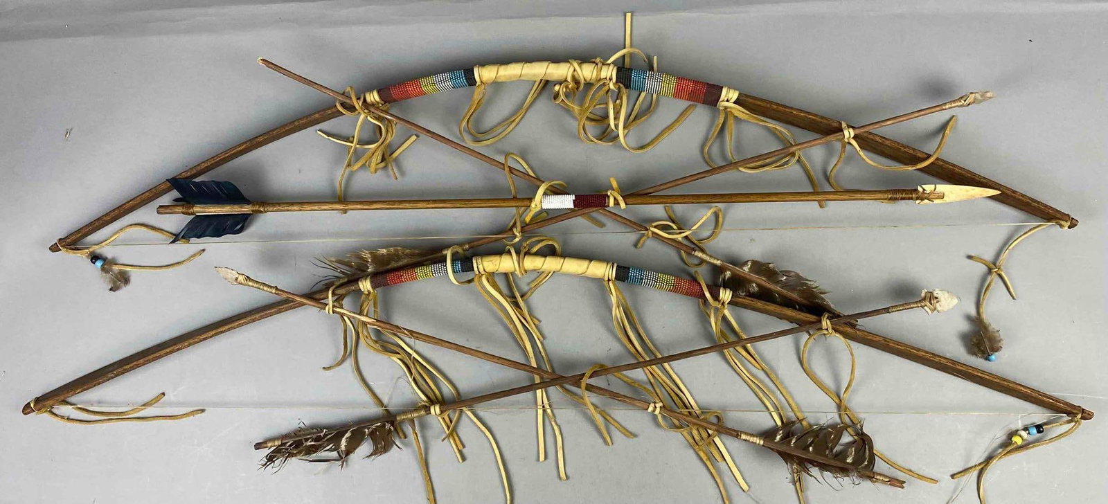 Group of 2 Native American Display Bows: Largest measures 40 inches in length.