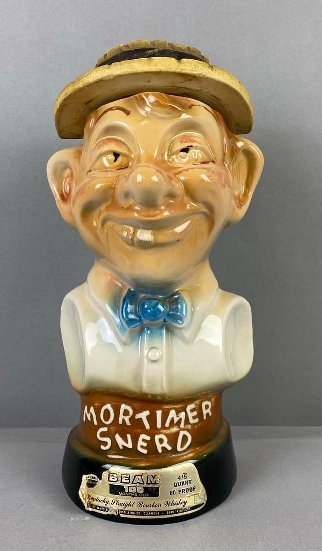 Jim Beam 4/5 Quart Mortimer Snerd Whiskey Decanter: Empty. Measures 11 inches in length.