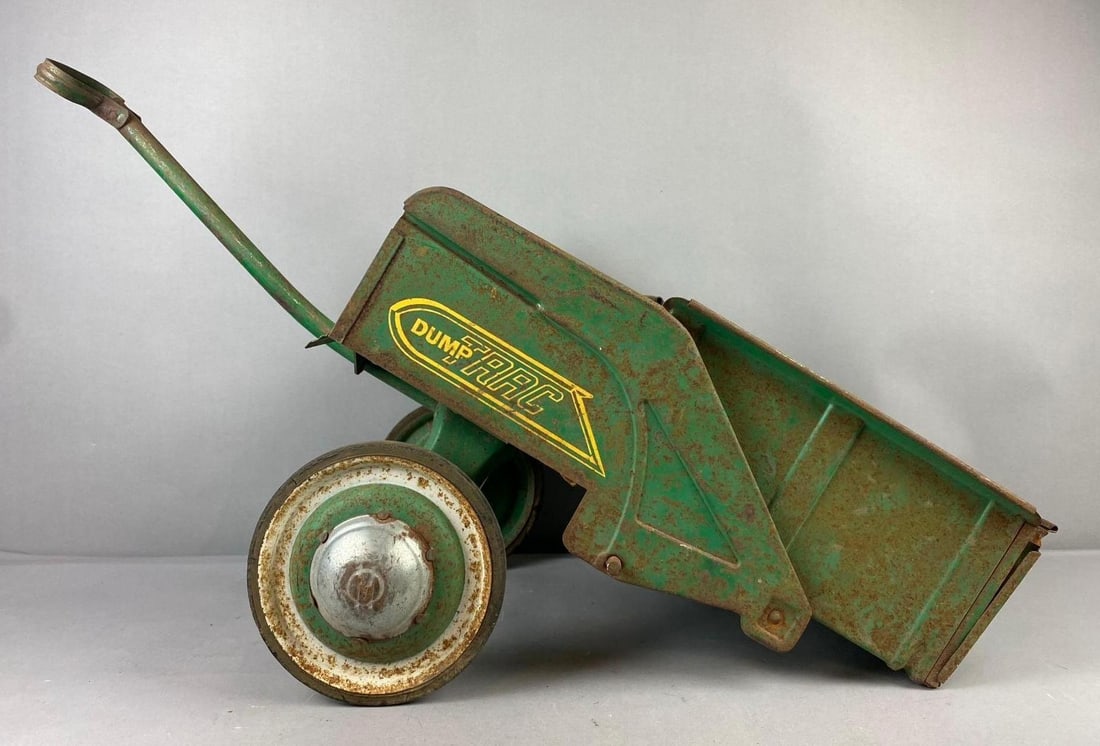 Vintage Murray Pedal Tractor Dump Trac Trailer: Circa 1960s. Has rust spots throughout. Measures H 14 x W 12 x L 34 inches.
