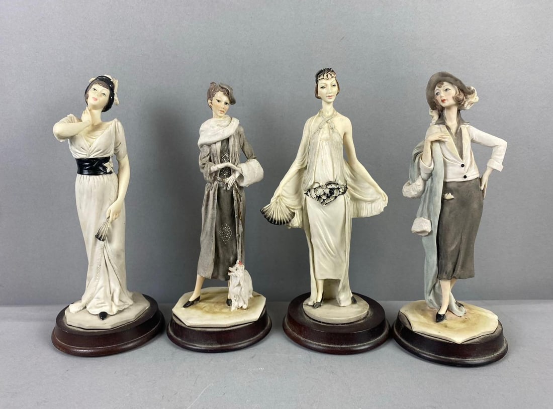 Group of 4 Giuseppe Armani Resin Figurines and More: Includes Pucci figures. Largest measures 9 1/2 inches in length.