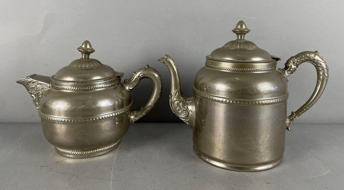 Group of 2 Vintage Rochester Stamping Works Silver Plated Teapots: One lid separated from hinge, measures 8" x 10 1/2" x 5 1/2"