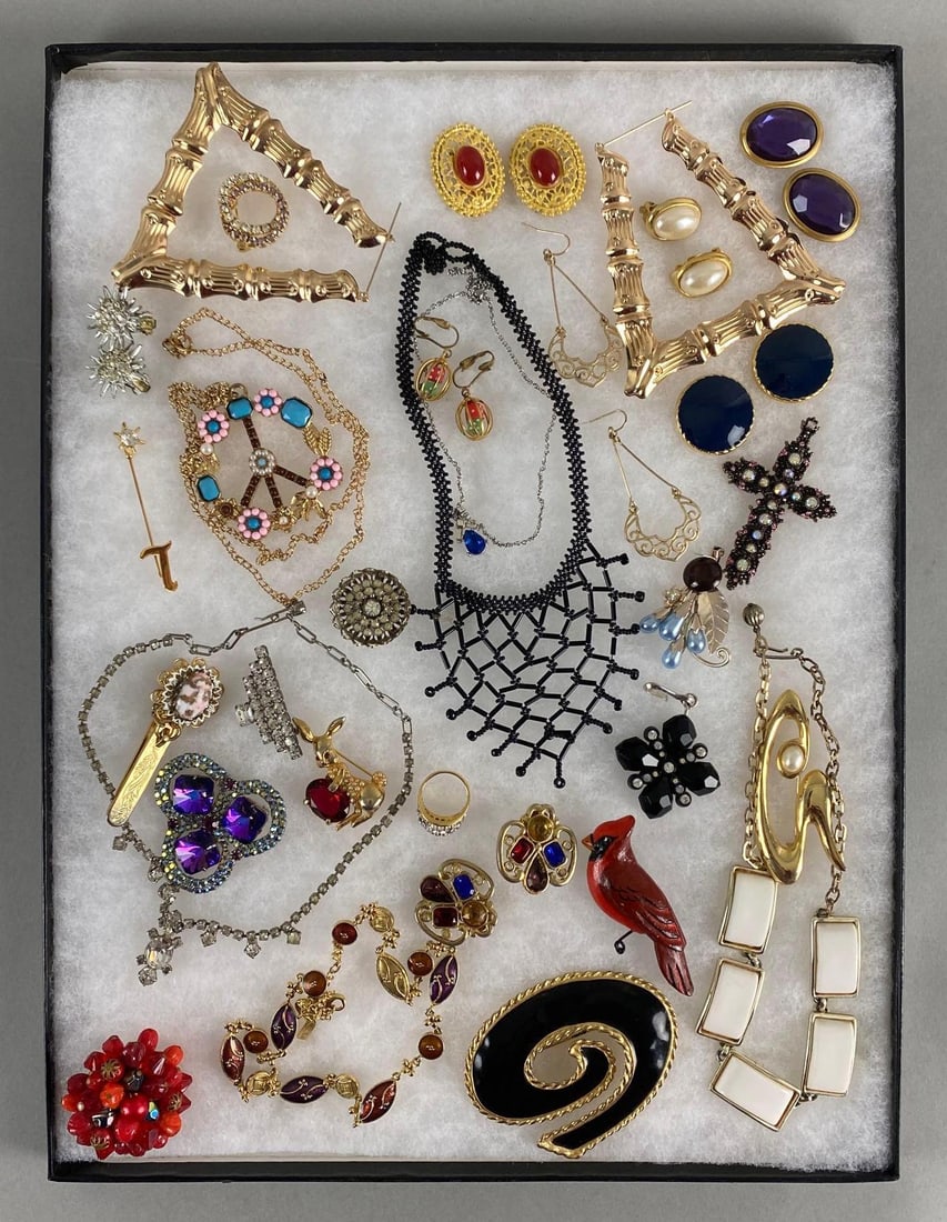 Group of 20+ Vintage Costume Jewelry Items: Riker Case not Included. Includes necklaces, rings, clip-on earrings, and more, Longest necklace measures 17 inches long.