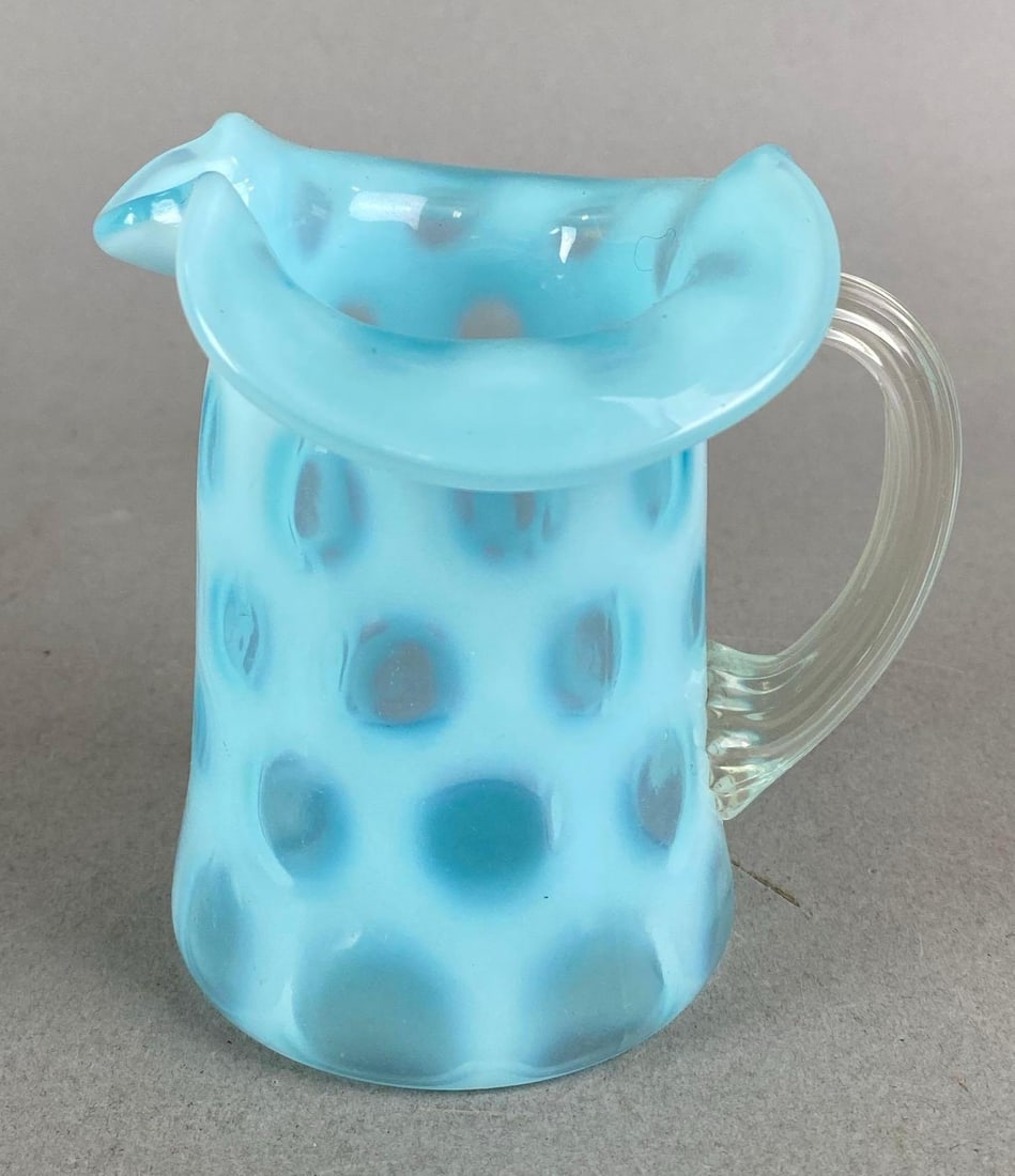 Fenton Blue Opalescent Coin Dot Creamer: Needs a good Cleaning. Measures H3 3/4 x W 3 1/2 x D 2 3/4 inches.