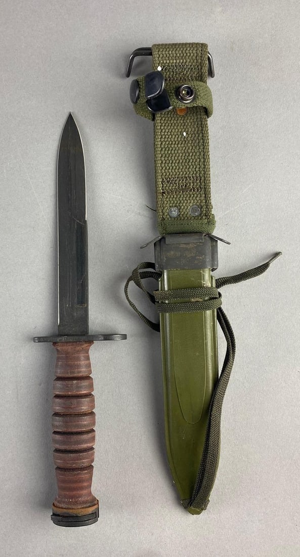 WWII US M4 Camillus Fight Knife With US M8A1 Sheath: Knife measures 11 1/2 inches in length. Small rust spots throughout.