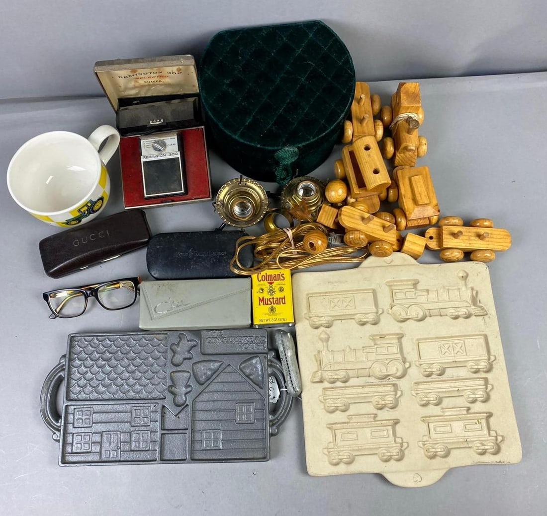 Group of Assorted Items: Includes Wood Train, Cast Iron Gingerbread House mold, and more. Largest measures L 12 x W 11 inches.