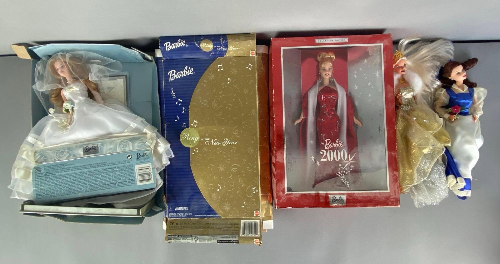Group of Assorted Mattel Barbie Fashion Dolls: Includes 2000, ring in the new year, Millennium wedding and more, some boxes damaged, needs cleaning, each doll measures 11 1/20 H