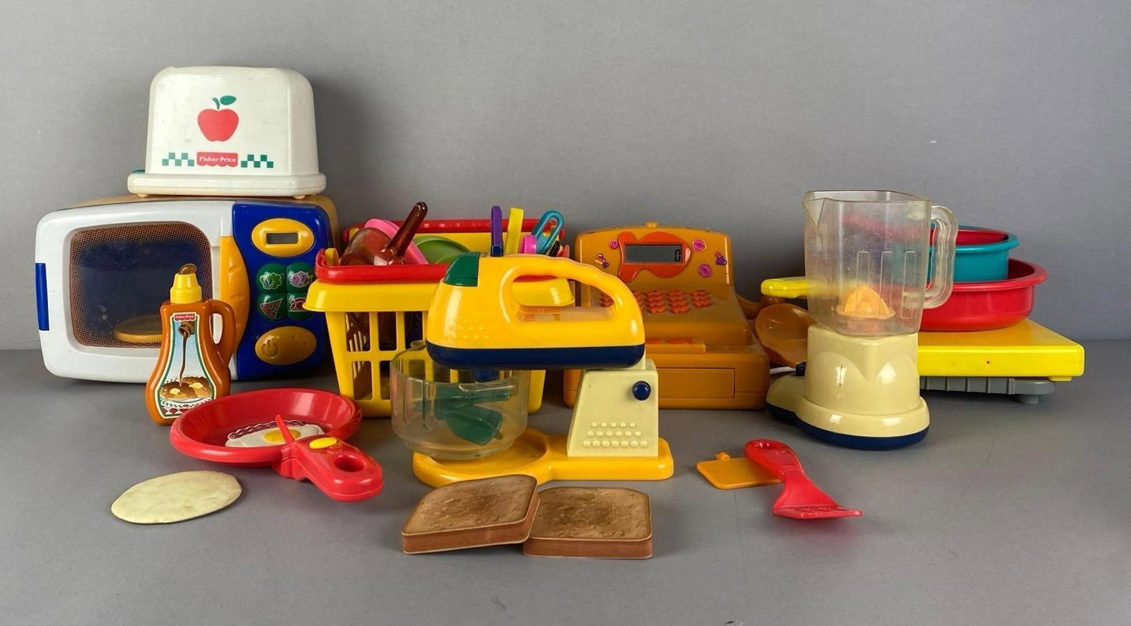 Group of Fisher-Price Children Cooking Toys: Untested, Includes microwave, skillets, food and more, largest measures 7 inches H x 10 inches W x 6 inches D