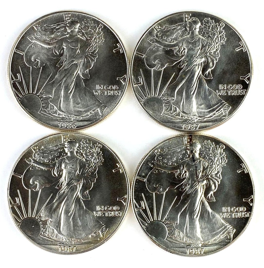 Group of 4 US 1 Oz American Silver Eagles: Includes years 1986-1987