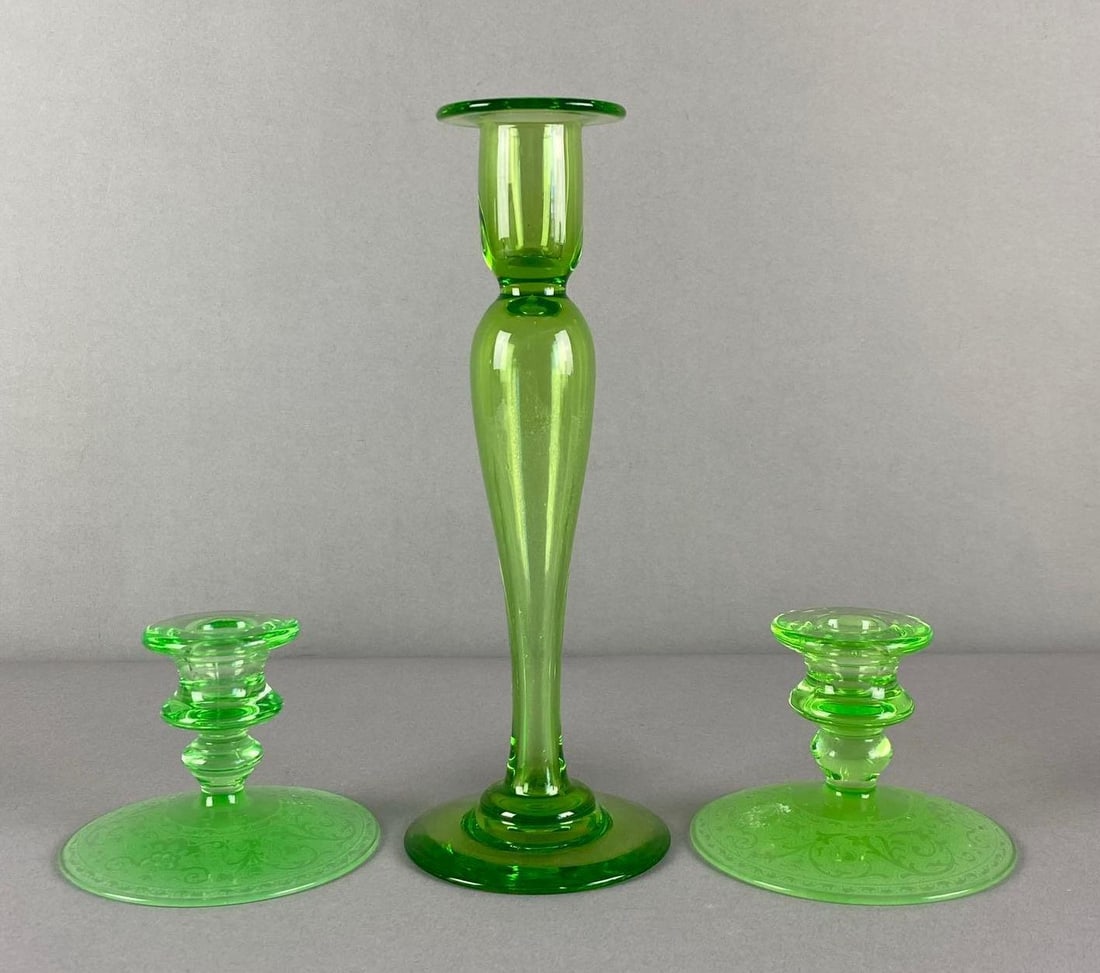 Group of 3 Antique Green Depression Glass Candlesticks: UV Reactive, tallest measures 10 3/4 inches H x 4 inches W