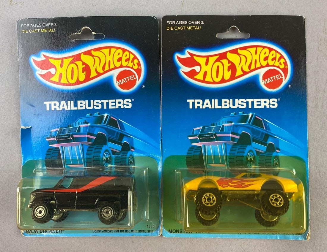 1988 Mattel HotWheels Trailbusters 1/64 Scale Die-Cast Vehicles: Includes Baja Breaker and Monster Vette. Like new in original packaging.