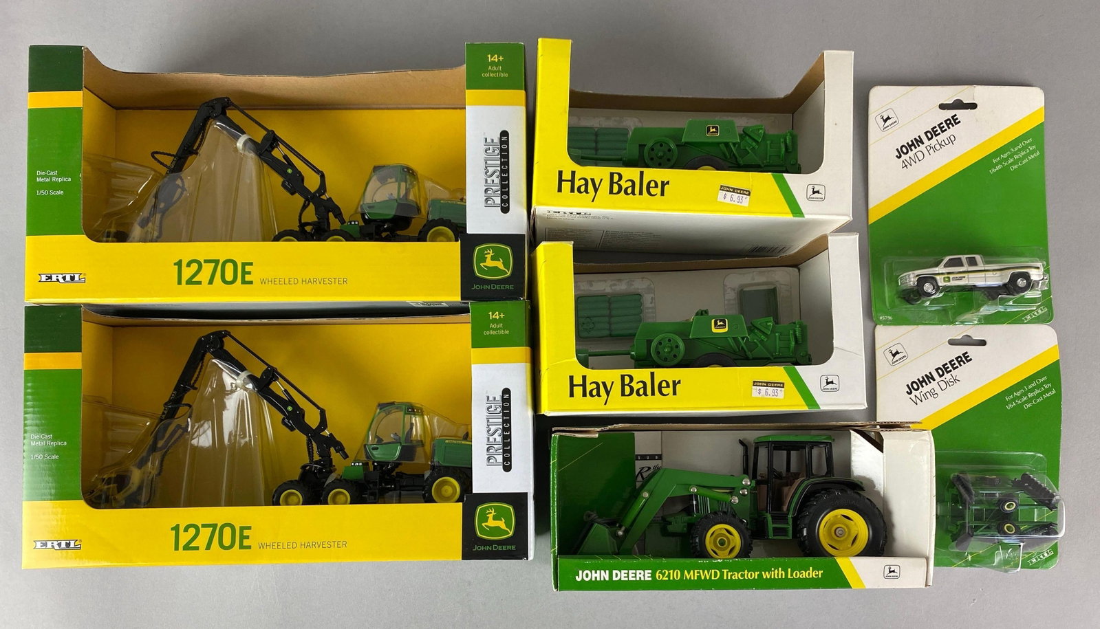 Group of 8 John Deere Die-Cast Vehicles: Includes 1270e wheeled harvester, hay baler, 4WD Pickup truck and more, largest is 1 / 32 scale