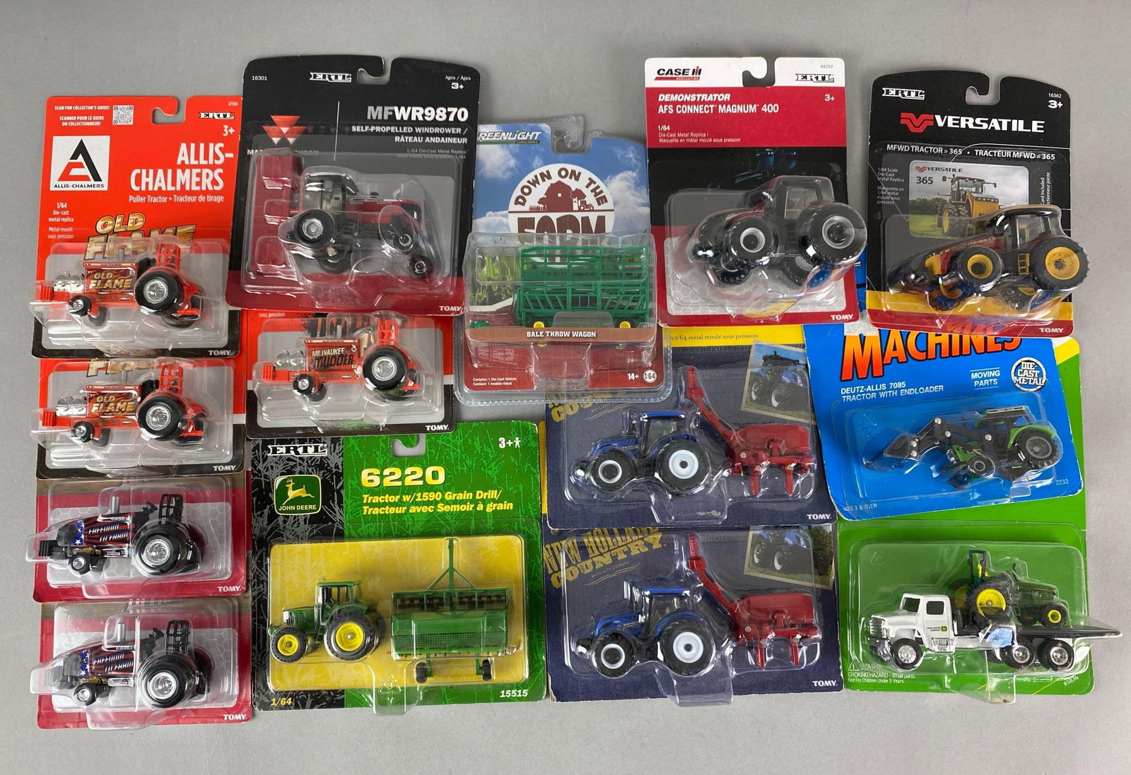 Group of Die-Cast Farming Vehicles and More: Includes Allie-Chalmers Puller tractor, John Deere 6220 Tractor, Versatile 365 and more, largest is 1 / 64 scale