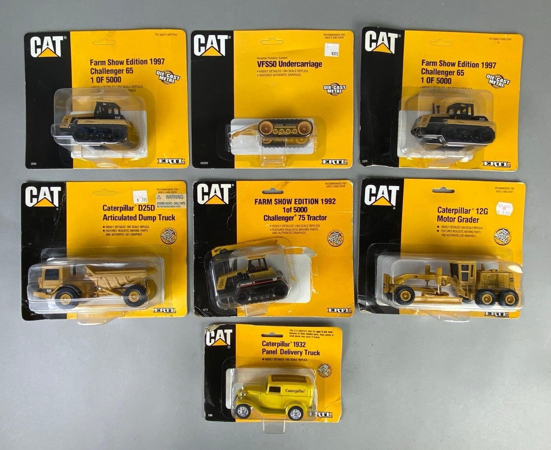 Group of 7 ERTL CAT Caterpillar Die-Cast Vehicles: Includes 1/64, and 1/43 scale, In original packaging, Includes VFS50 Undercarriage, Caterpillar 1932 Panel Delivery Truck, 12G Motor Grader, and more, One not attached to backing, Largest packaging