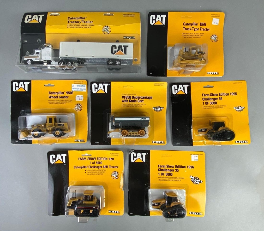 Group of 7 ERTL CAT Caterpillar Die-Cast Vehicles: 1/64 scale, In original packaging, Includes Caterpillar Tractor/Trailer, 950F Wheel Loader, Farm Show Edition 1991 Caterpillar Challenger 65B Tractor, and more, Largest packaging measures 6 1/2 x 12