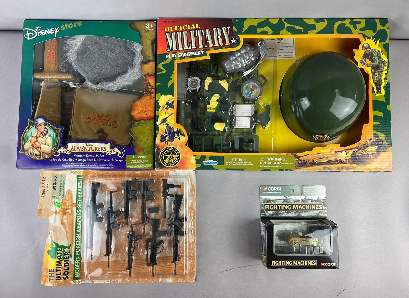 Group of Assorted Military Themed Toys and More: Includes Disney Adventures Dave Crockett, military play equipment, and more. Largest measures H 2 1/2 x W 13 x L 20 inches.